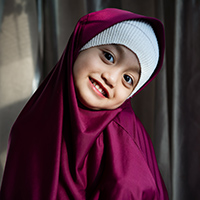 portrait of a toddler girl in hijab smiling and l 2023 11 27 05 06 43 utc